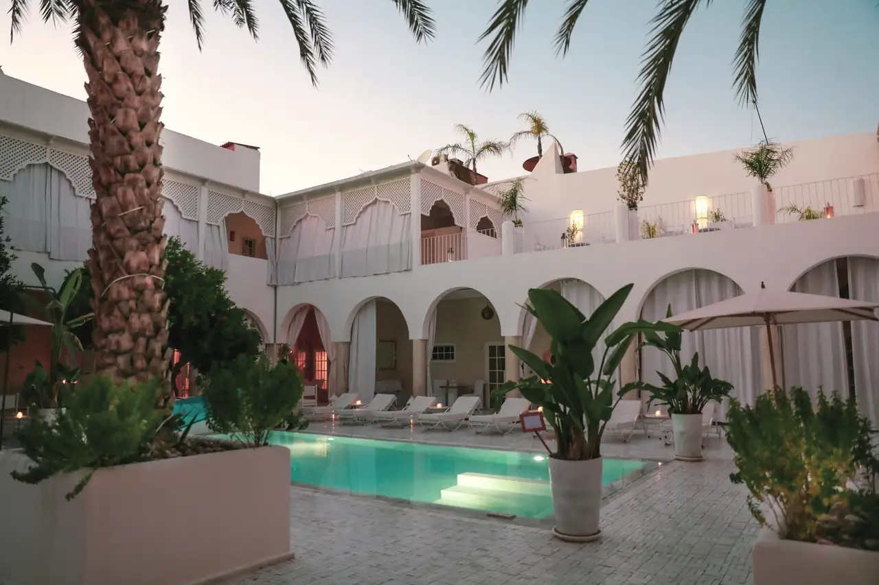 The courtyard and its pool at dusk